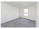 A bedroom with neutral paint and carpet with window letting in natural light at 8091 Crumwell Dr, Avon, IN 46123