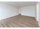 A spacious bedroom with wood-look floors, and neutral color palette throughout at 8091 Crumwell Dr, Avon, IN 46123
