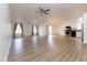 Bright and airy open-concept living space with vaulted ceilings, light-colored walls, and wood flooring at 8091 Crumwell Dr, Avon, IN 46123
