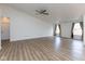 Open living area featuring wood floors, neutral walls, and large windows offering plenty of natural light at 8091 Crumwell Dr, Avon, IN 46123