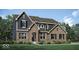 Beautiful new construction home featuring a brick and siding exterior, complemented by a well-manicured lawn and landscape at 9101 Rockville Pl, McCordsville, IN 46055