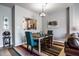 Elegant dining area with a colorful rug and comfortable seating at 10246 Eller Creek Dr, Fishers, IN 46038