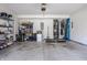 Spacious two car garage featuring ample storage, water heater, garage door opener, and concrete floor at 10246 Eller Creek Dr, Fishers, IN 46038