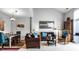 Open-concept living room with stylish furniture, a dining area, and plenty of natural light at 10246 Eller Creek Dr, Fishers, IN 46038