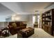 Cozy loft featuring a comfortable couch, wooden furnishings, and a warm color palette at 10246 Eller Creek Dr, Fishers, IN 46038