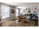 Bright home office with hardwood floors, built-in shelving, and a dedicated workspace at 10246 Eller Creek Dr, Fishers, IN 46038