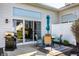 Cozy patio with outdoor seating, grill, sliding door, and privacy fence, perfect for entertaining at 10246 Eller Creek Dr, Fishers, IN 46038