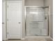 Bathroom featuring a glass-enclosed shower with white tile and modern fixtures at 10246 Eller Creek Dr, Fishers, IN 46038