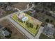 Aerial view showcasing the property's boundaries, pool, lush lawn, and surrounding neighborhood at 1032 Westview Point Dr, Columbus, IN 47201