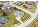 An aerial view of a two-story home that features an in-ground pool and a basketball court at 1032 Westview Point Dr, Columbus, IN 47201