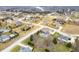 Aerial view showing multiple homes in a suburban neighborhood and a beautiful lake at 1032 Westview Point Dr, Columbus, IN 47201
