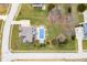 Aerial view of a home showcasing its pristine lawn and private pool at 1032 Westview Point Dr, Columbus, IN 47201