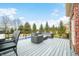 Relaxing outdoor seating on the deck offers views of the yard and surrounding landscape at 1032 Westview Point Dr, Columbus, IN 47201