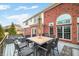 Expansive deck features a full outdoor kitchen and dining set, offering ample space for gatherings and relaxation at 1032 Westview Point Dr, Columbus, IN 47201