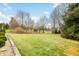 A sprawling green lawn offers endless possibilities in the spacious backyard at 1032 Westview Point Dr, Columbus, IN 47201