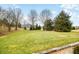 Expansive backyard with lush greenery and mature trees offering serene privacy at 1032 Westview Point Dr, Columbus, IN 47201
