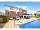 Expansive backyard features a covered pool, hot tub, and outdoor seating area at 1032 Westview Point Dr, Columbus, IN 47201