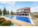 An oversized pool with a diving board is the focal point of this backyard at 1032 Westview Point Dr, Columbus, IN 47201