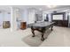 A basement features a pool table, carpet flooring, and a home theater at 1032 Westview Point Dr, Columbus, IN 47201