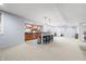 Finished basement wet bar and kitchen with cabinets, stainless appliances, and counter seating at 1032 Westview Point Dr, Columbus, IN 47201