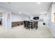 Basement dining area with built in cabinets, a dark wood table, and ample seating at 1032 Westview Point Dr, Columbus, IN 47201