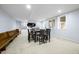 Basement dining area with a large table, seating for eight, and built-in cabinets at 1032 Westview Point Dr, Columbus, IN 47201