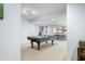 Finished basement space with a billiards table, carpeted floors, and wet bar at 1032 Westview Point Dr, Columbus, IN 47201