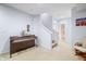 Spacious finished basement featuring carpeted floors, a piano, and easy access to a full bathroom at 1032 Westview Point Dr, Columbus, IN 47201