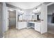 Bathroom featuring tile floors, double sinks, vanity area, and an open closet area at 1032 Westview Point Dr, Columbus, IN 47201