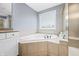 A luxurious soaking tub in a bathroom with tile surround and a window at 1032 Westview Point Dr, Columbus, IN 47201