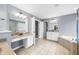 Bright primary bathroom with soaking tub, shower, dual sinks, and vanity at 1032 Westview Point Dr, Columbus, IN 47201