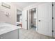 Bathroom view with access to bedroom and toilet area, featuring tile flooring at 1032 Westview Point Dr, Columbus, IN 47201