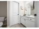 Bathroom with toilet and vanity with white cabinets and countertop at 1032 Westview Point Dr, Columbus, IN 47201