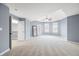 Bright and airy bedroom with neutral carpet, ceiling fan, and views to the backyard at 1032 Westview Point Dr, Columbus, IN 47201