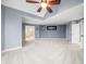 Large carpeted primary bedroom with ensuite bath and neutral color palette at 1032 Westview Point Dr, Columbus, IN 47201