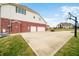 Long driveway showcasing the three-car garage and basketball hoop at 1032 Westview Point Dr, Columbus, IN 47201