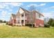 Beautiful two-story home with a large lawn and mature trees at 1032 Westview Point Dr, Columbus, IN 47201