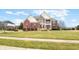 Charming two-story home with a well-manicured lawn and mature landscaping at 1032 Westview Point Dr, Columbus, IN 47201