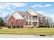 Beautiful two-story brick home with a stone facade and second story balcony at 1032 Westview Point Dr, Columbus, IN 47201