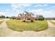 Scenic shot of a two-story home surrounded by a lush lawn in a suburban neighborhood at 1032 Westview Point Dr, Columbus, IN 47201