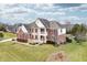 Aerial view of an attractive brick and siding home with manicured front yard, set in a well-kept neighborhood at 1032 Westview Point Dr, Columbus, IN 47201
