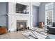 Cozy living room fireplace with decorative mantel, hearth, and wall-mounted TV at 1032 Westview Point Dr, Columbus, IN 47201