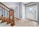 Elegant foyer with hardwood floors, staircase and a decorative glass front door at 1032 Westview Point Dr, Columbus, IN 47201