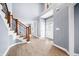 Grand two-story foyer featuring hardwood floors, a staircase, and natural light at 1032 Westview Point Dr, Columbus, IN 47201