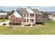 An aerial view of a beautiful brick home with well-maintained front yard and landscaping, showcasing curb appeal at 1032 Westview Point Dr, Columbus, IN 47201