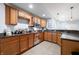 A kitchen features wooden cabinets, a microwave, tile flooring, and a bar area at 1032 Westview Point Dr, Columbus, IN 47201
