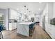 Modern kitchen with a large island, marble countertops, and stainless steel appliances at 1032 Westview Point Dr, Columbus, IN 47201