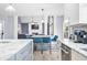 Modern kitchen with marble island, stainless steel appliances, and open layout to the living room at 1032 Westview Point Dr, Columbus, IN 47201