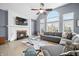 Bright living room with vaulted ceiling, fireplace and large windows offering plenty of natural light at 1032 Westview Point Dr, Columbus, IN 47201