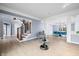 Spacious open-concept living room with hardwood floors, staircase, and a dining area with seating for eight at 1032 Westview Point Dr, Columbus, IN 47201
